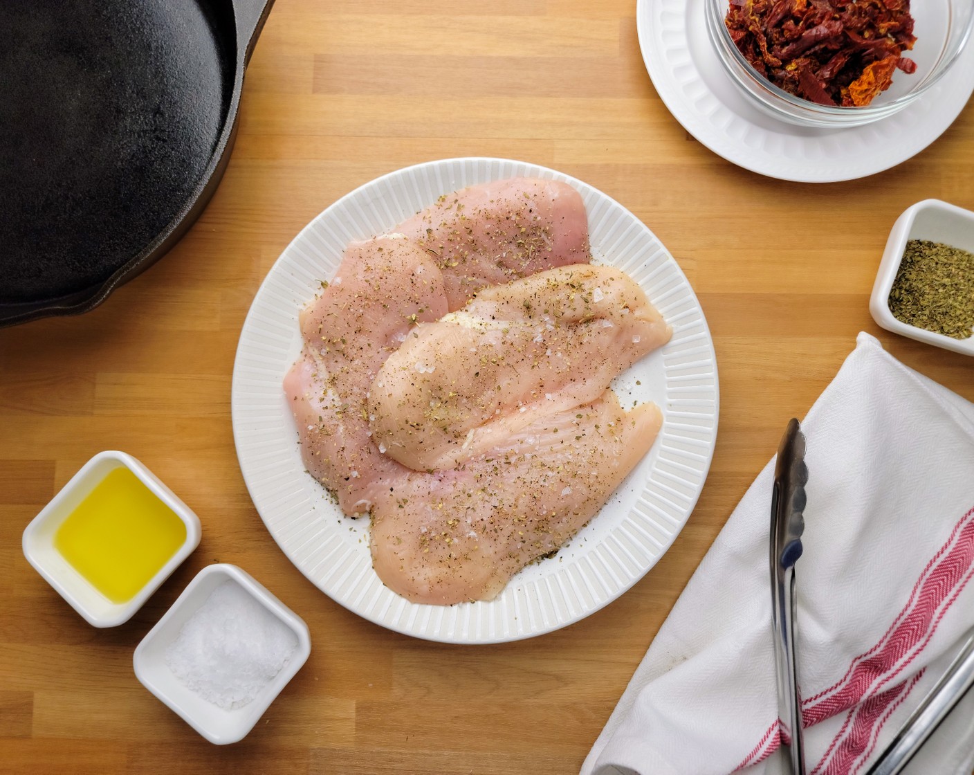step 4 Bring a pot of salted water to a boil. While the water is heating, pat the chicken breasts dry with paper towels, then season the Boneless, Skinless Chicken Breasts (1.5 lb) all over with Kosher Salt (2 tsp), Ground Black Pepper (1 tsp), and Italian Seasoning (1 Tbsp).