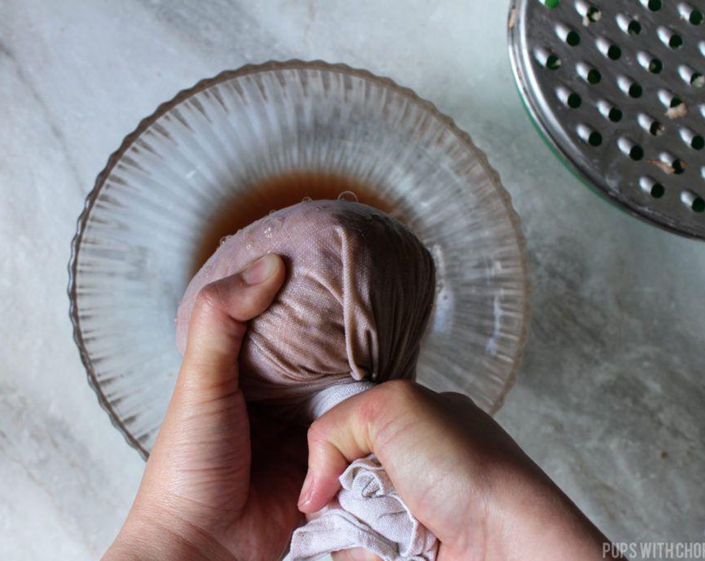 step 5 Squeeze out as much as the water as you can. Discard the water that was squeezed out. Unravel the tight ball of squeezed potatoes, lightly loosen it up, and mix in the Onion (1).