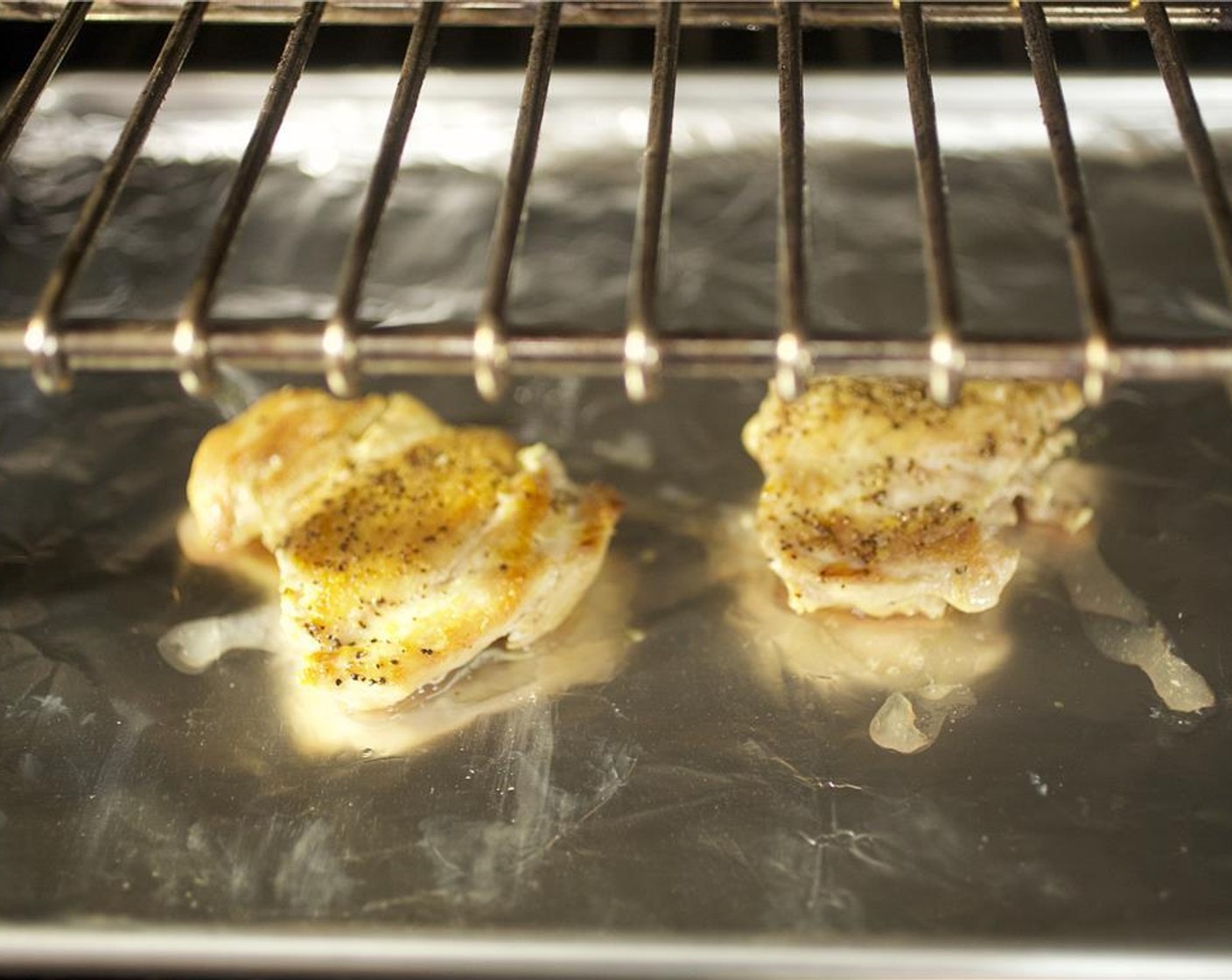 step 7 Heat a large saute pan over medium-high heat and add 1 tablespoon of olive oil. Season the Chicken Thighs (2) with 1/4 teaspoon each of salt and pepper. When the oil is hot, add the chicken and sear for 4 to 5 minutes on each side or until cooked through.
