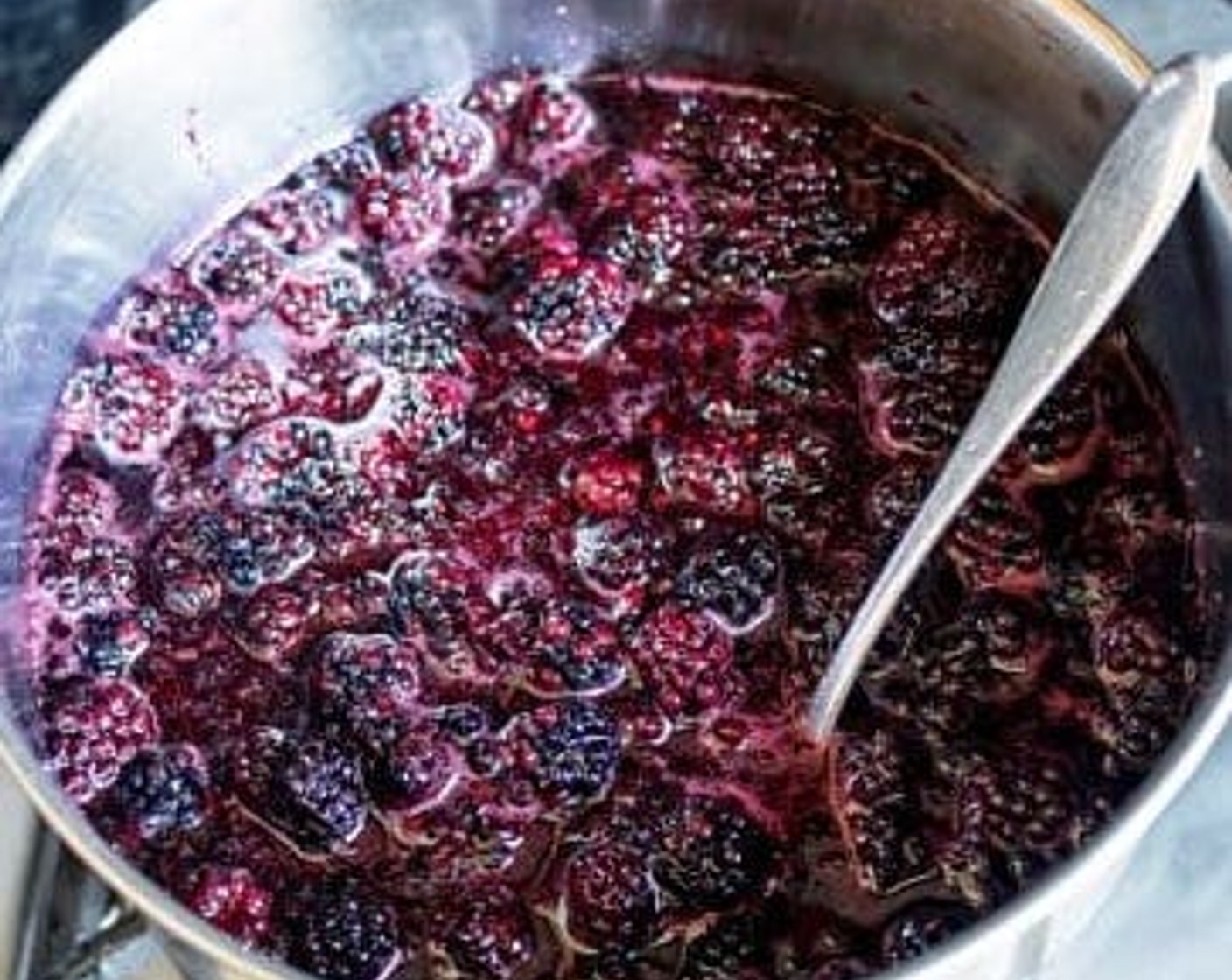step 2 Place the saucepan on low heat for 3 minutes to gently warm up the blackberries without boiling. Stir often until the sugar has dissolved entirely and has developed a nice deep blackberry flavor to the juice.