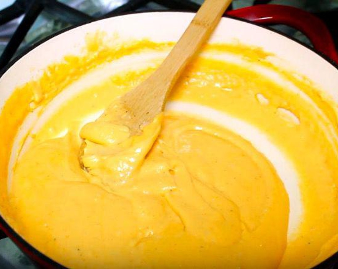 step 3 Add Sharp Cheddar Cheese (2 cups) and Mozzarella Cheese (1 cup), reserving a bit for topping. Turn the heat off and allow the cheese to melt, whisking throughout.