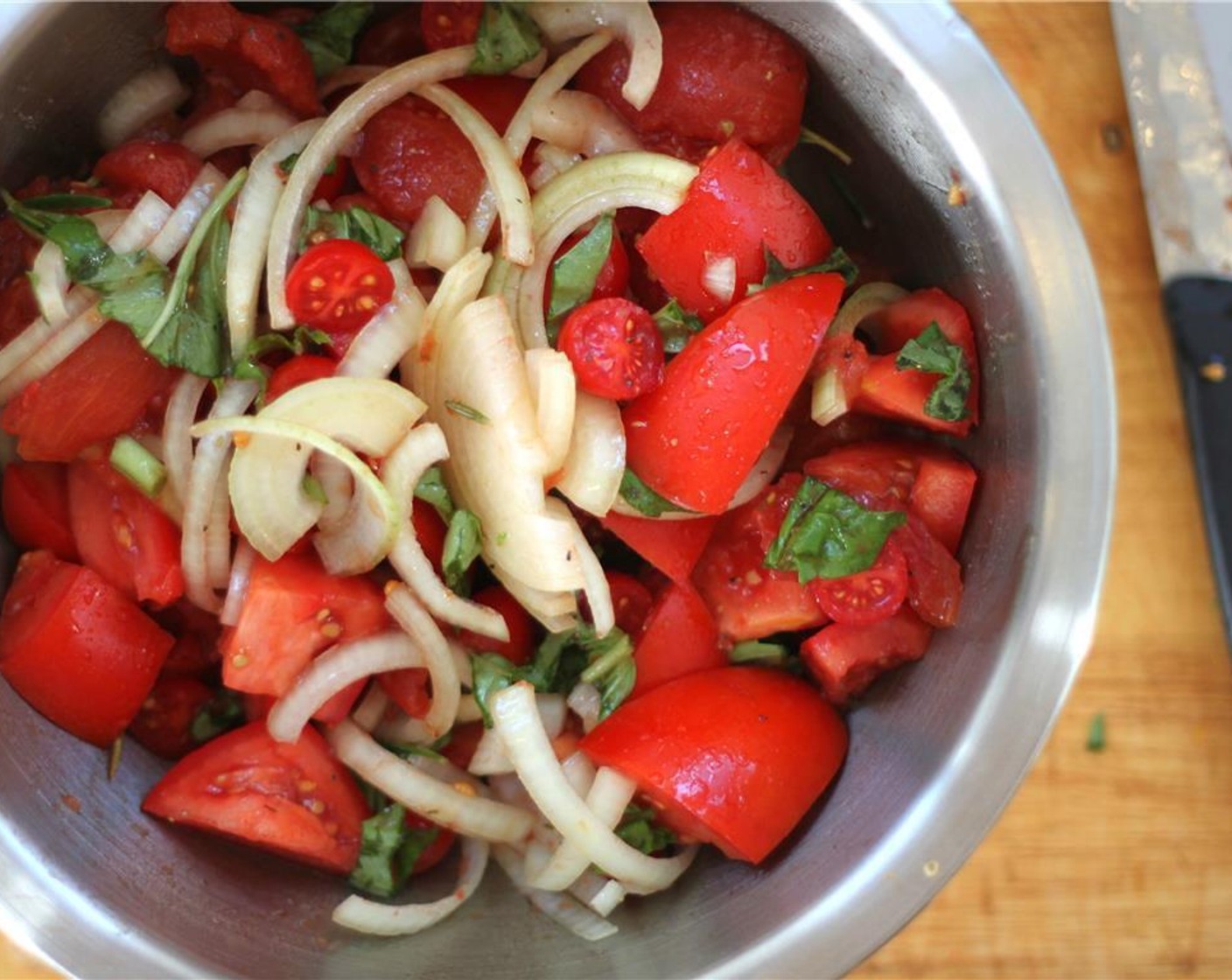 step 2 Toss all the Roma Tomatoes (6), Cherry Tomatoes (2 cups), Stewed Tomatoes (2 cans), Yellow Onion (1), 3/4 cup of the Fresh Basil (1 cup), Dried Oregano (1 Tbsp), {@10:}, Fresh Rosemary (4 sprigs), Olive Oil (3 Tbsp), and Balsamic Vinegar (2 Tbsp) in a large bowl. Season with {@11:} and Ground Black Pepper (to taste).