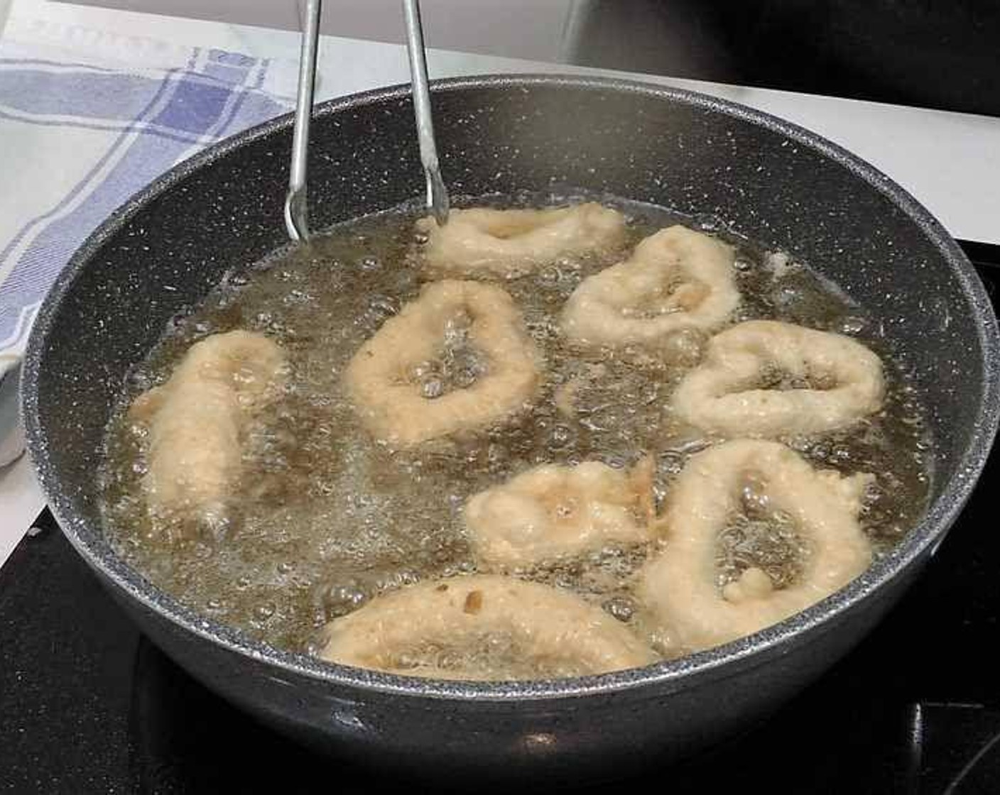step 5 Once the oil is hot, fry the calamari until golden.