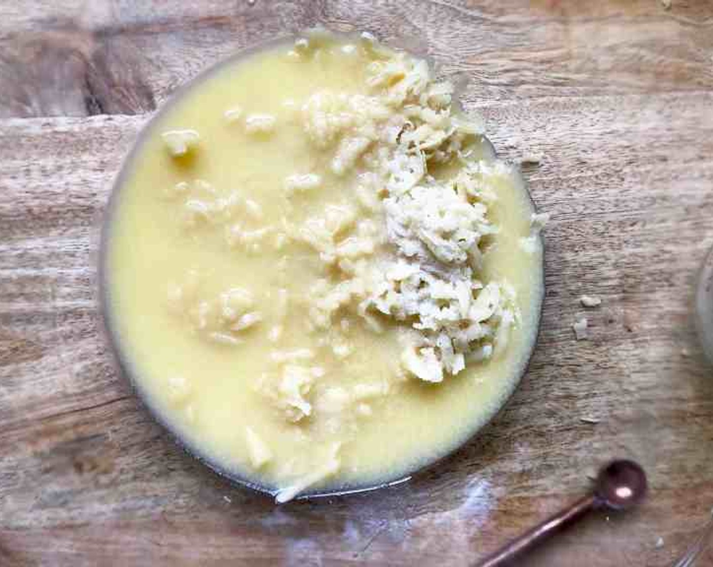 step 4 Grate the Almond Paste (3/4 cup) and place it in the bowl of a stand mixer fitted with the flat beater attachment. Add the Salt (1/4 tsp) and Unsalted Butter (3/4 cup), beat for 1 to 2 minutes, until smooth.