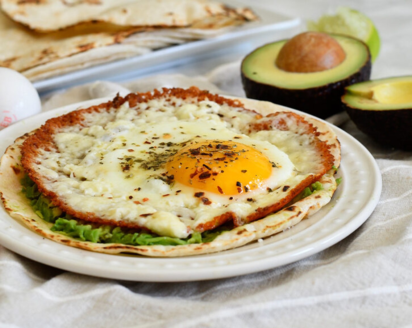 step 4 Cook until the feta turns golden/brown and the egg is cooked to your preference, medium or runny.
Warm the Flour Tortilla (1) on a gas stove or pan. Top with the sliced Avocado (1/2), drizzle with Lime Juice (1 tsp), and smash with a fork. Carefully top with the fried egg and enjoy!