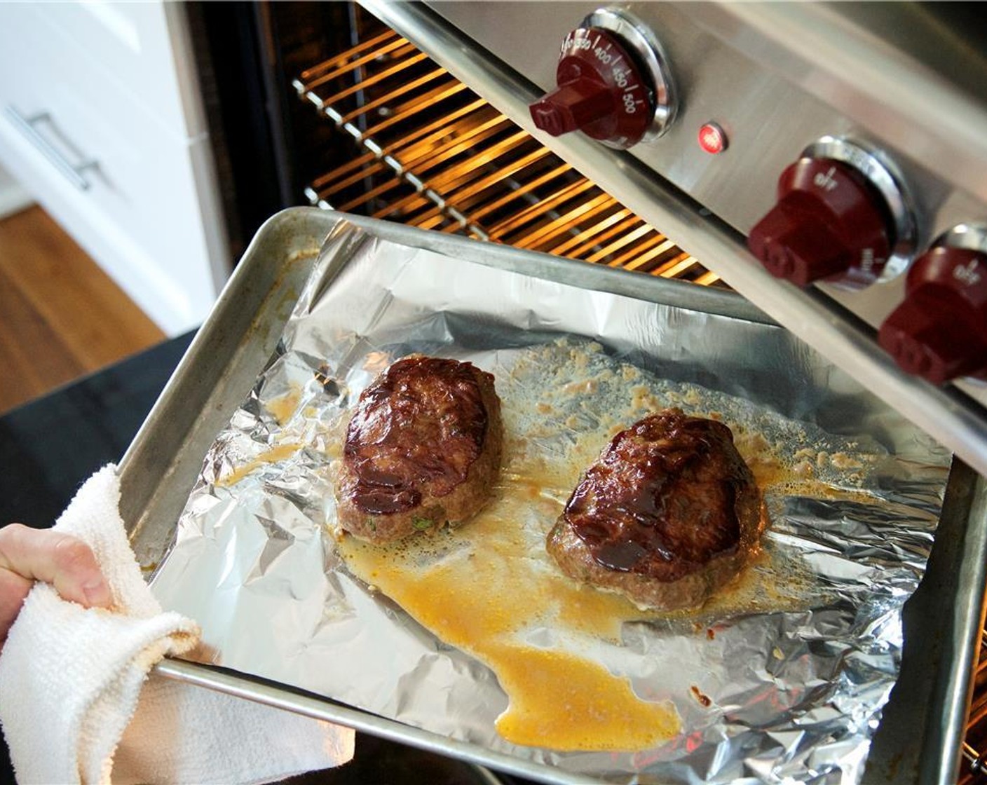 step 7 Shape mixture into two equally portioned mini loaves and place on sheet pan lined with foil. Spread ketchup-barbecue sauce evenly on top of each loaf. Bake for 30 minutes or until cooked through.